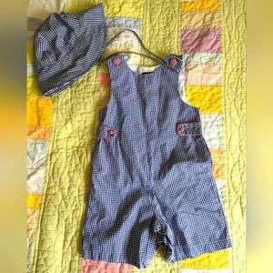Blue gingham one piece outfit with matching sun hat.